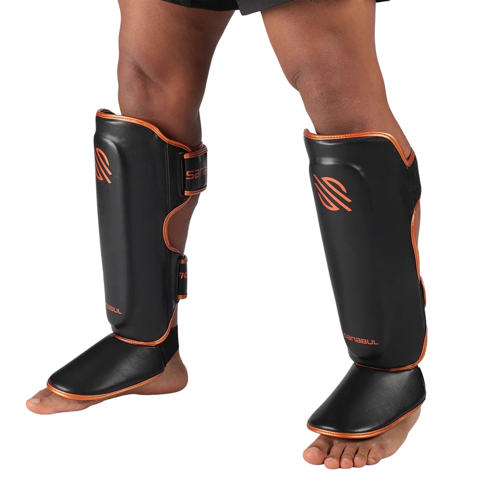 Black and Orange Shin Guards